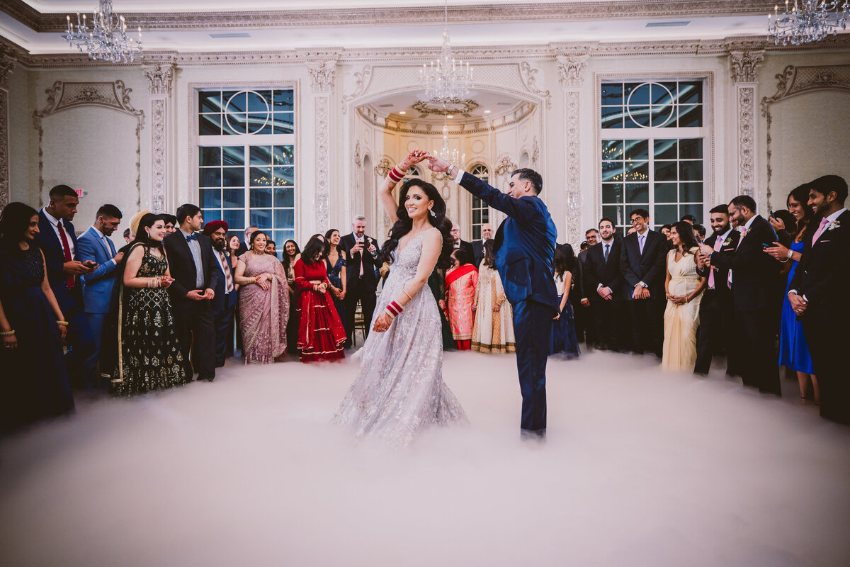 Bride and groom having their first dance at their indian wedding reception