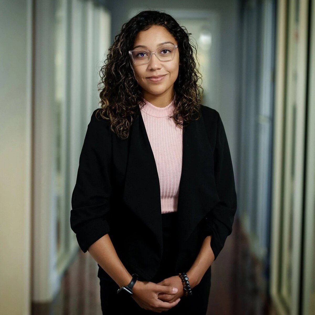 Professional NJ headshot of businesswoman with natural approachable expression indoors
