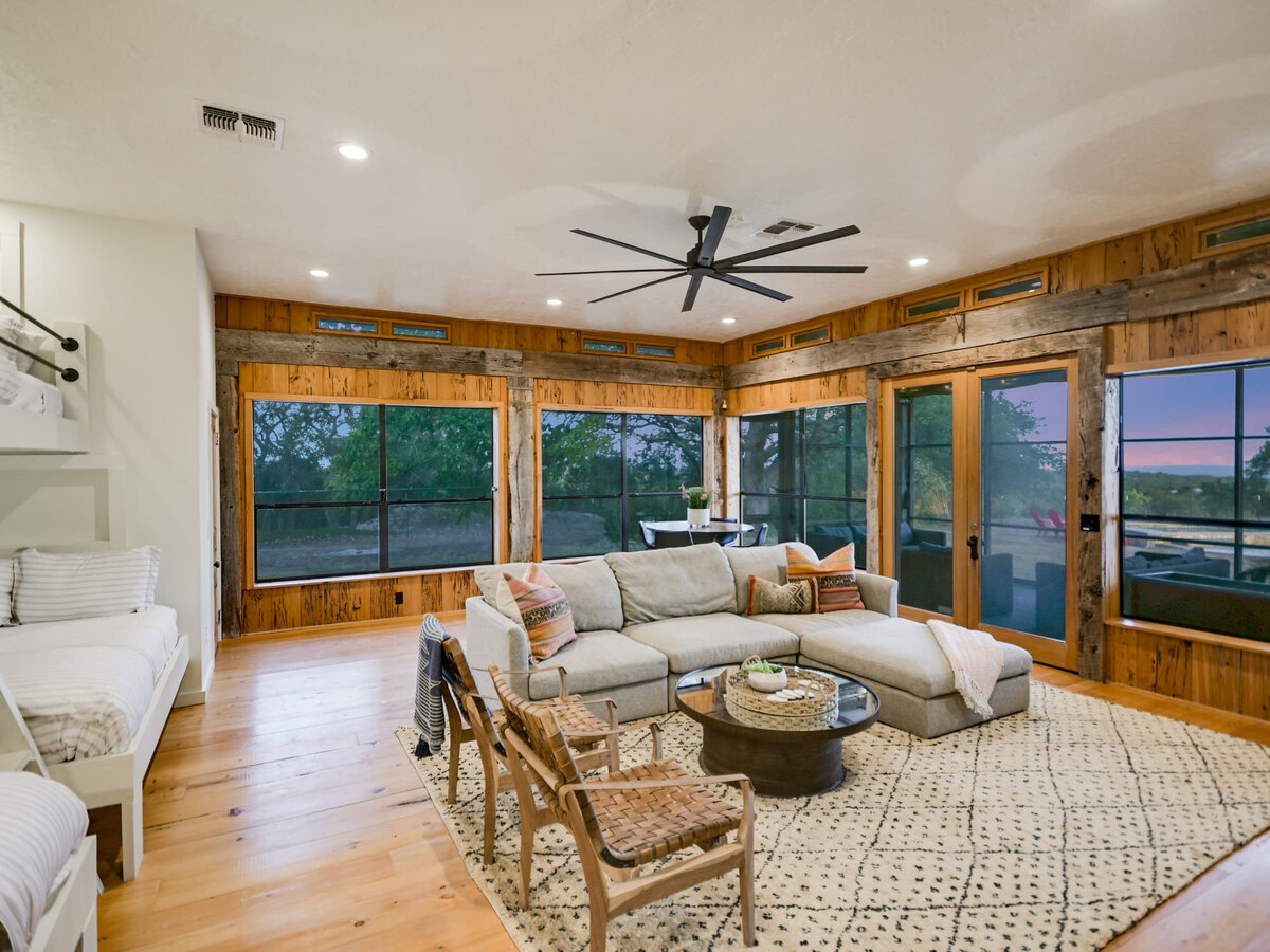 Gameroom with large windows and comfy seating area