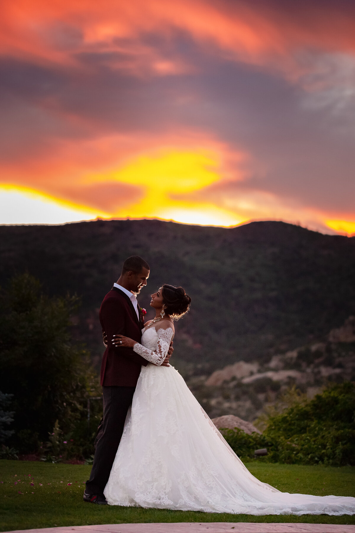 Bride and Groom Look at Each Other During Sunset