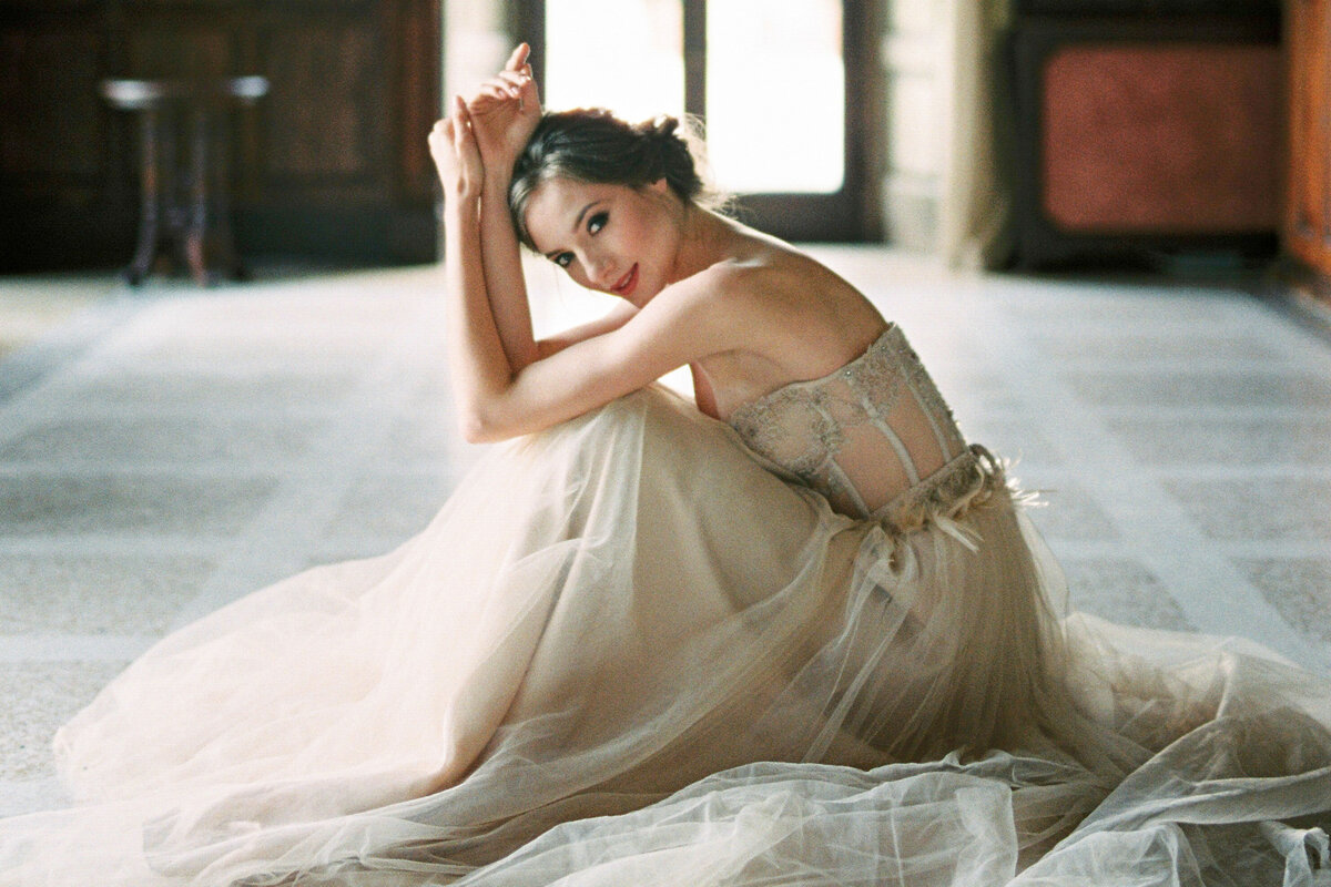 Timeless bridal portrait of a bride in tulle gown, taken by Toronto-based wedding photographer in classic venue setting