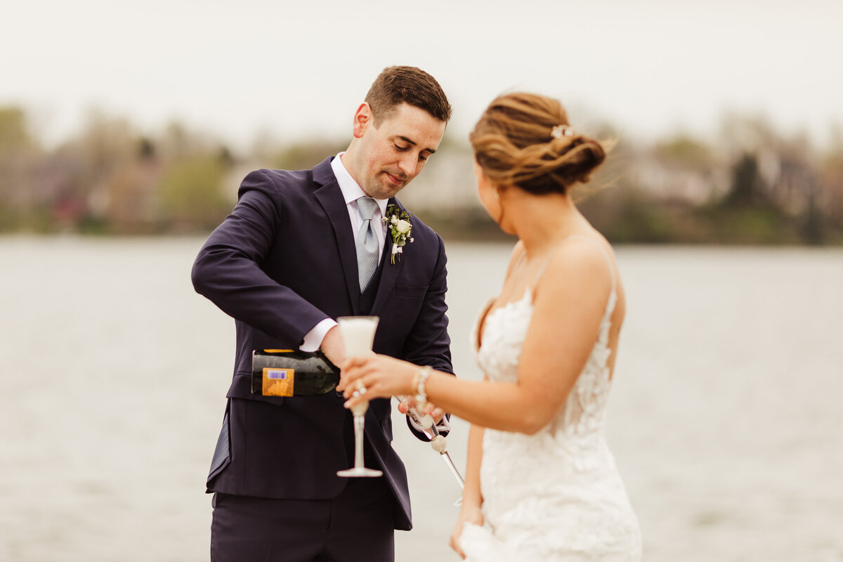 Groom pouring some bubbles