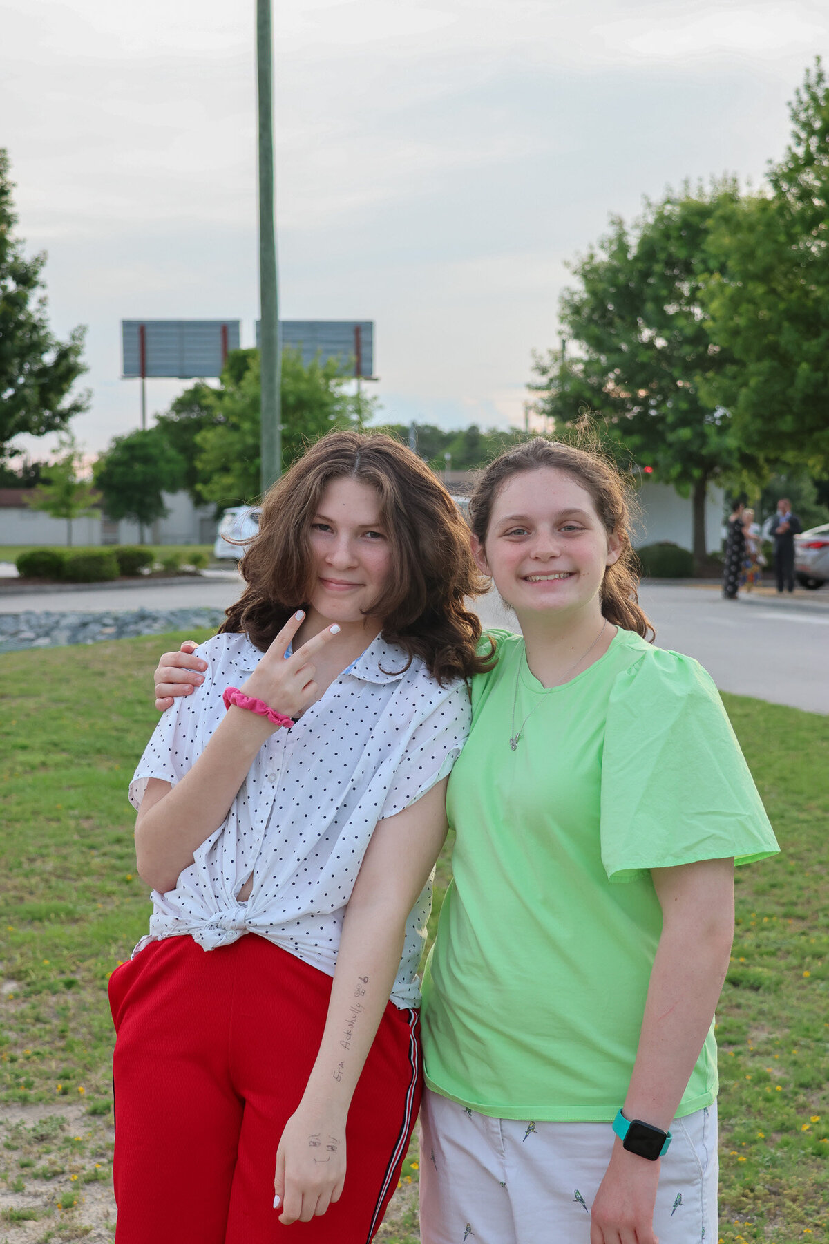 Teenage girls smiling at a non-denominational church in Fayetteville, NC.