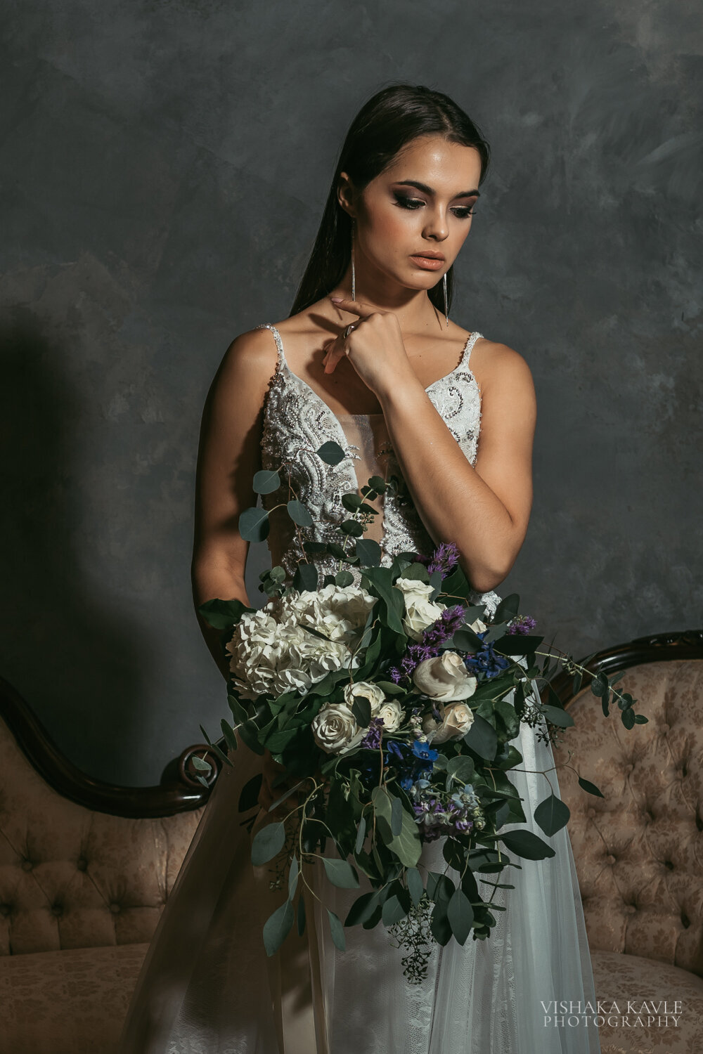 bride wearing her wedding dress and holding her bridal bouquet