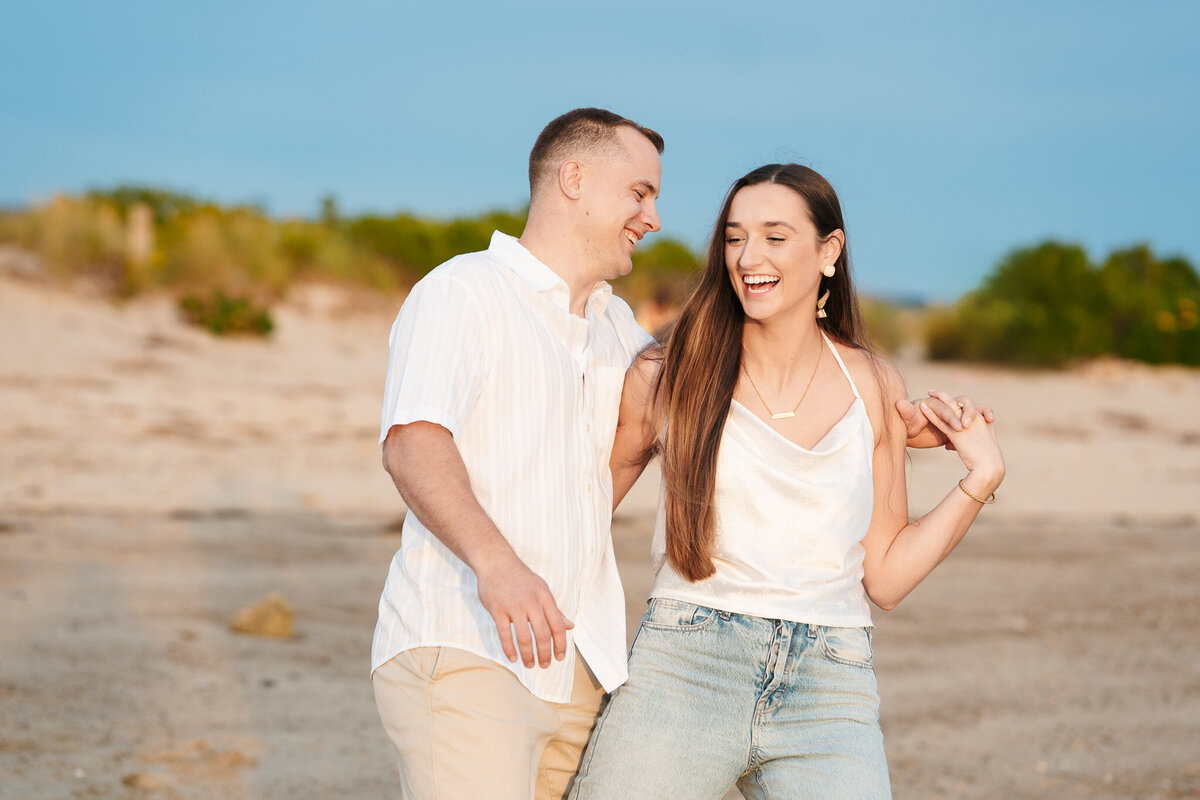 Candid ocean engagement portraits in New England with relaxed emotional storytelling