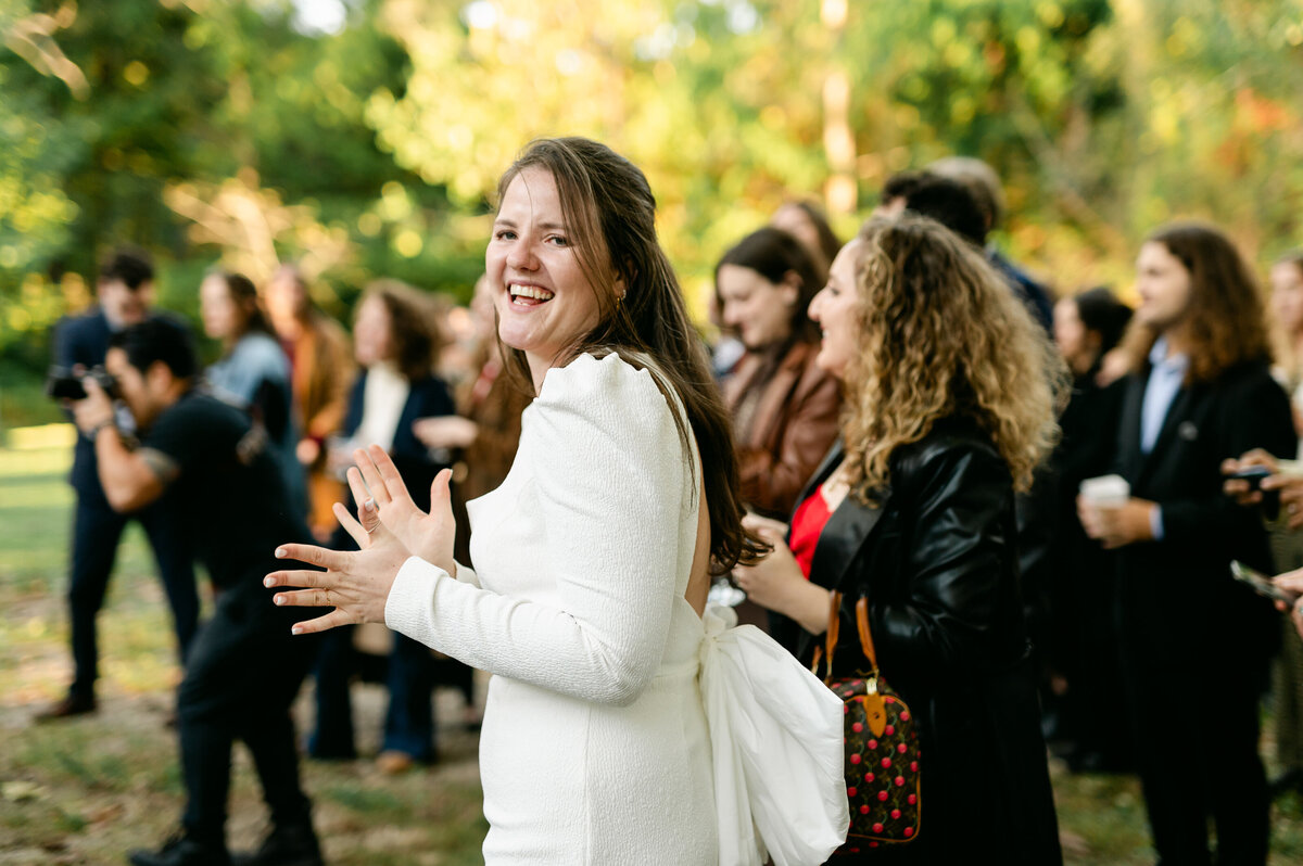 Bride clapping and smiling