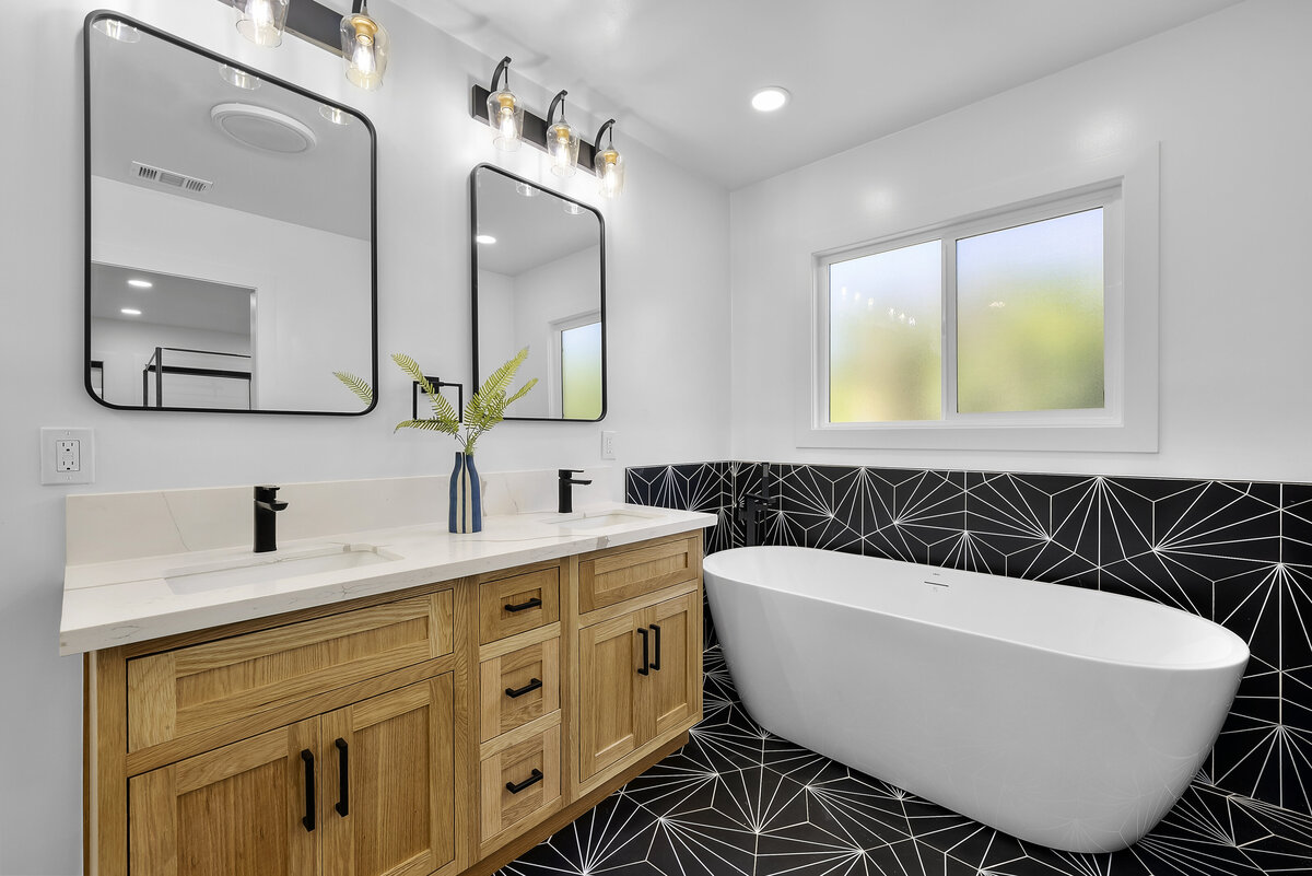 modern-bathroom-remodel-black-tile-vanity-tub-aw-development
