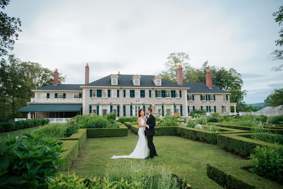 bride and groom dancing in garden at hildene lincoln family home manchester vermont wedding