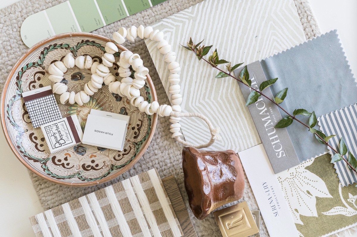 rebekah nicole interiors flat lay with neutrals greens and blues