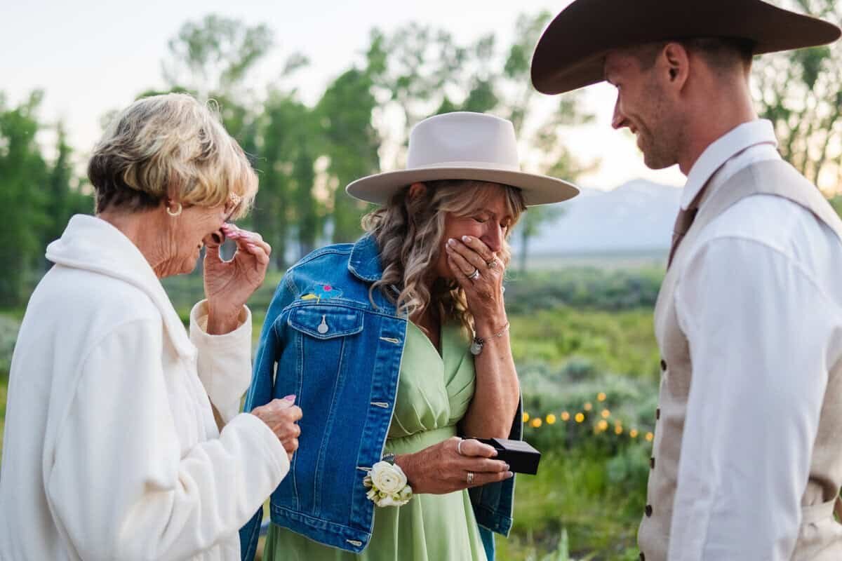 mother and grandmother cry at son's jackson hole wedding