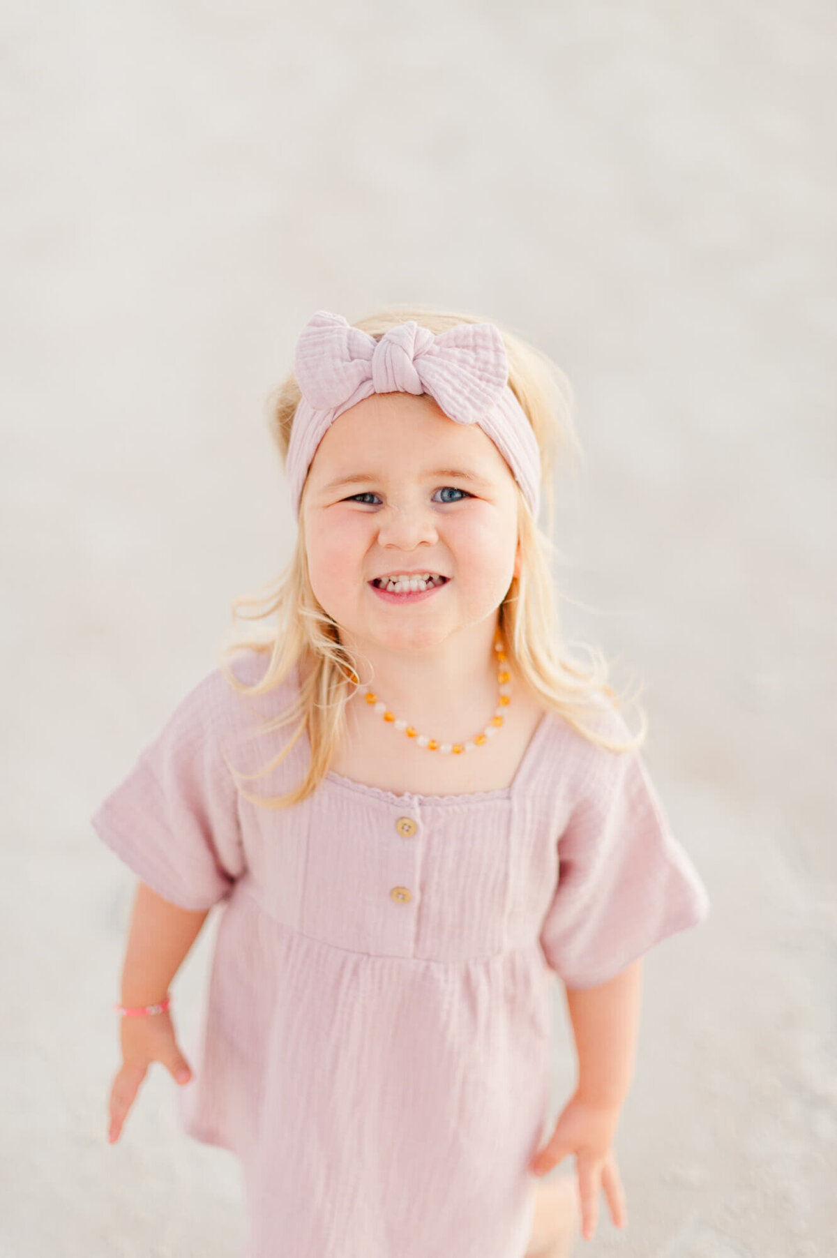 Close up of daughter smiling at New Smryna Dunes Park at sunset