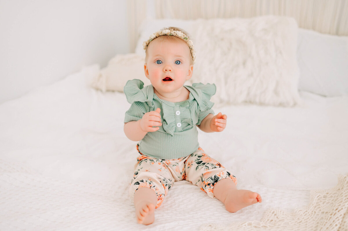baby girl in green in Branson MO baby photography studio