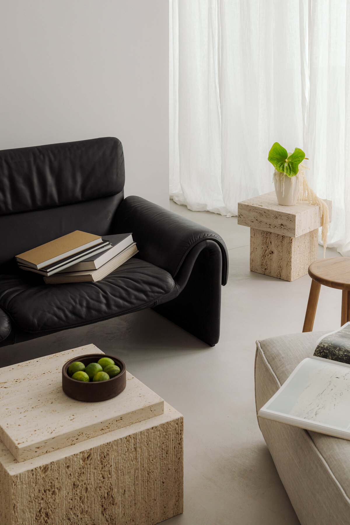 kaboompics_black-leather-sofa-with-travertine-coffee-table-japandi-living-room-37335