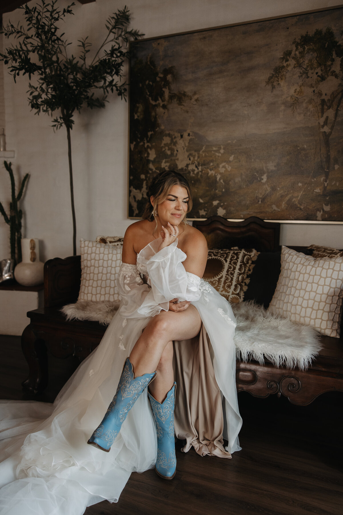 tivoli wedding, bridal suite photos, bride sitting with her legs crossed, bride wearing boots