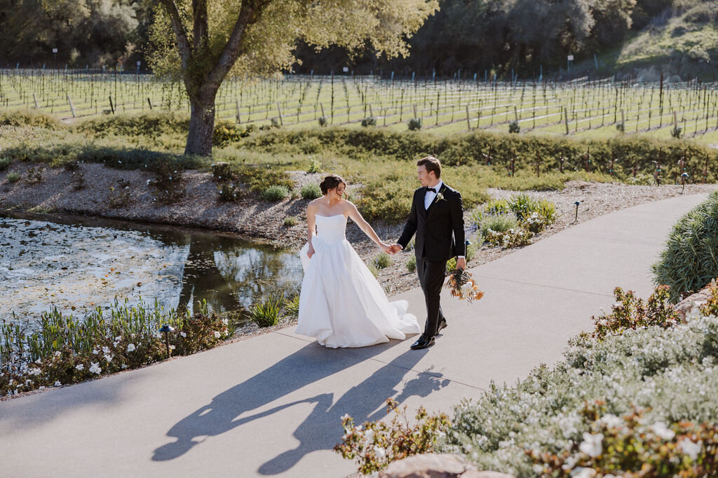 bride and groom walking on path monserate winery wedding editorial, timeless, candid
