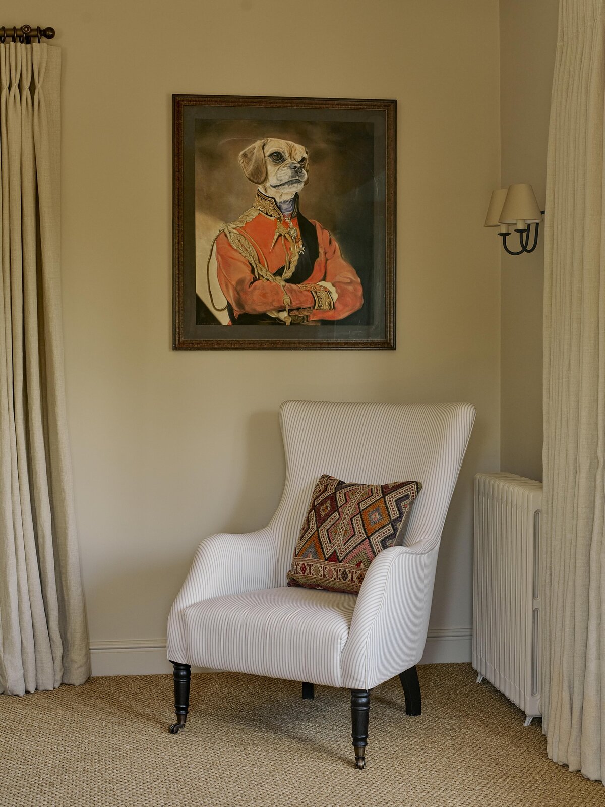 Armchair with painting of dog behind