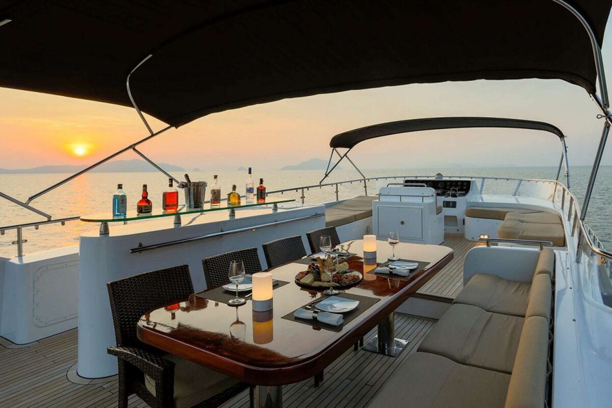 Luxury yacht anchored under the stars, offering an exclusive overnight charter experience in Thailand.