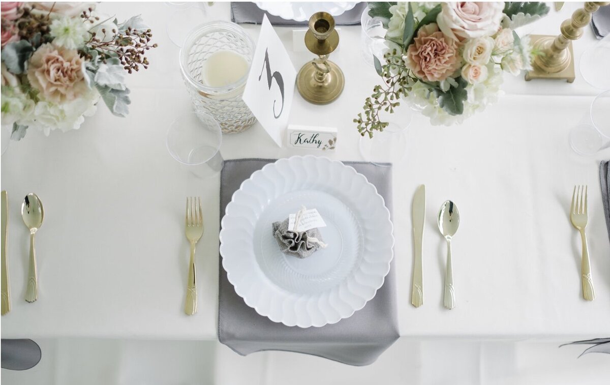Place setting at backyard tent wedding