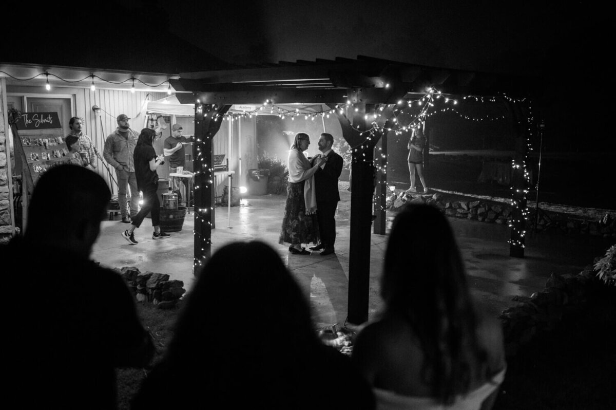groom-and-mother-dance-under-pergola
