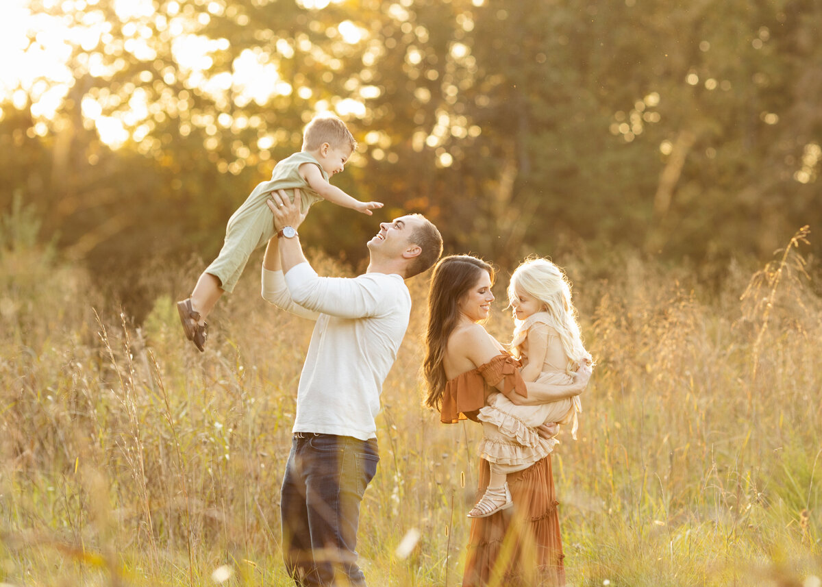 Charlotte Family Photography session in field at sunset with earth tone clothes