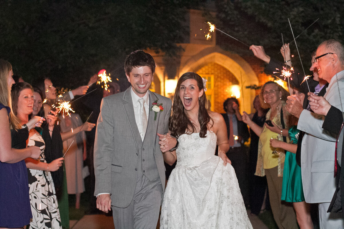 njeri-bishota-lauren-ashley-bride-cheering-excitment-wedding-reception-sparklers