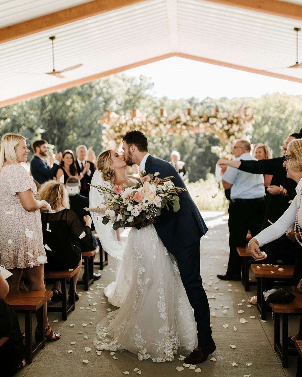 Natalie Brown wedding - groom kissing bride