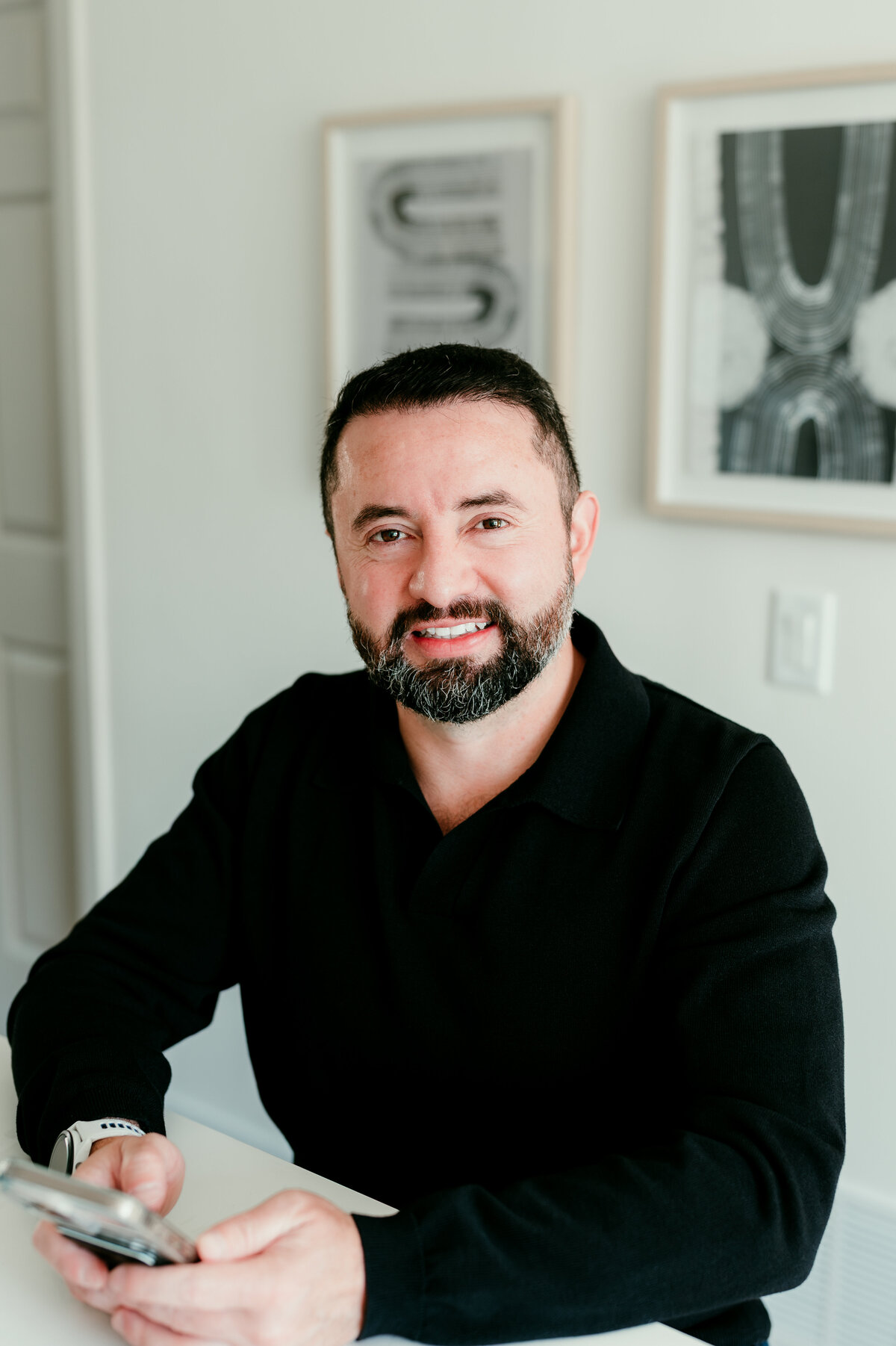Polished dating profile headshot of a man in a clean, neutral outfit, taken in Minneapolis for use on dating apps like Bumble and Hinge.