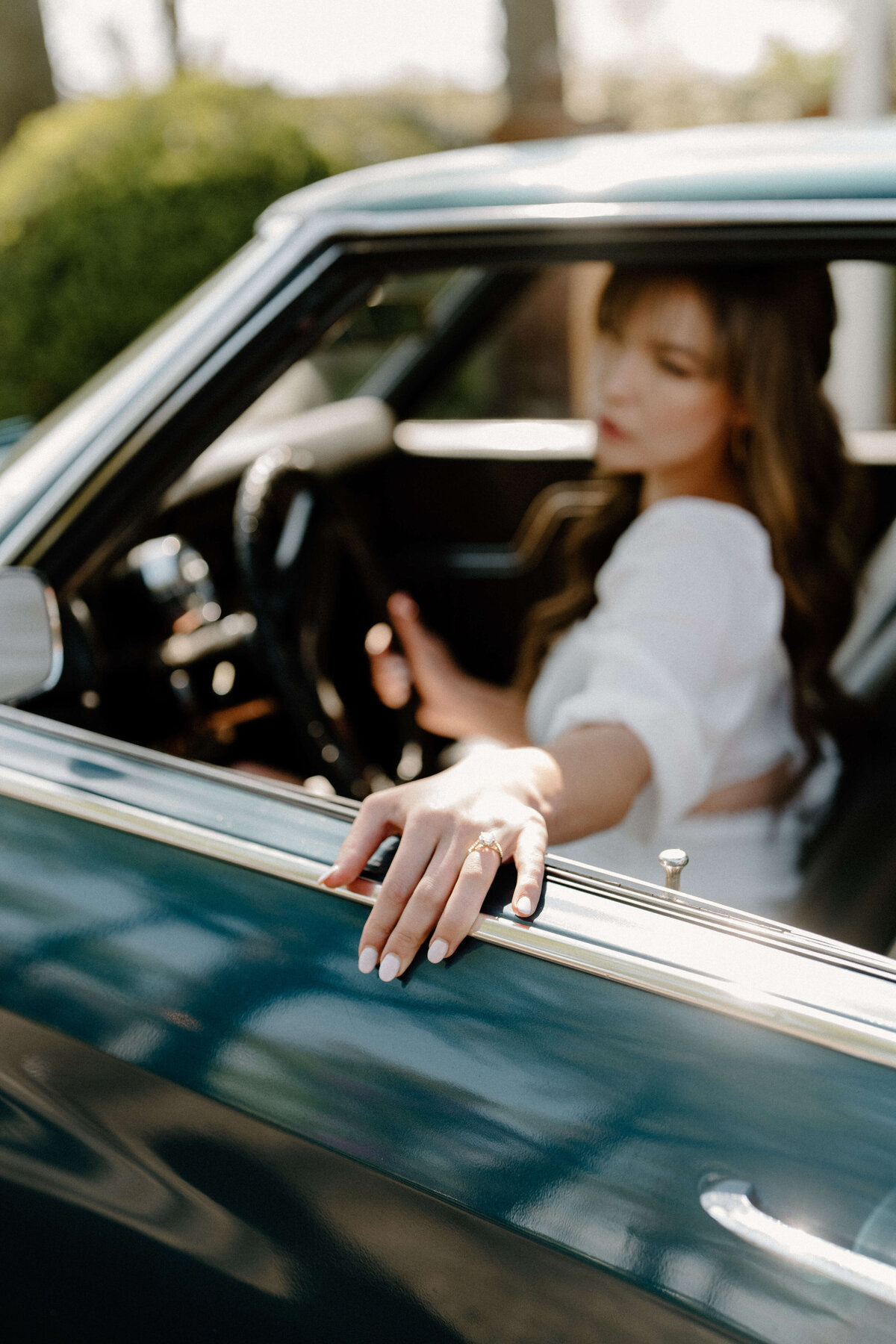 bride sitting in vintage car at at white chimneys estate wedding, Lancaster, PA