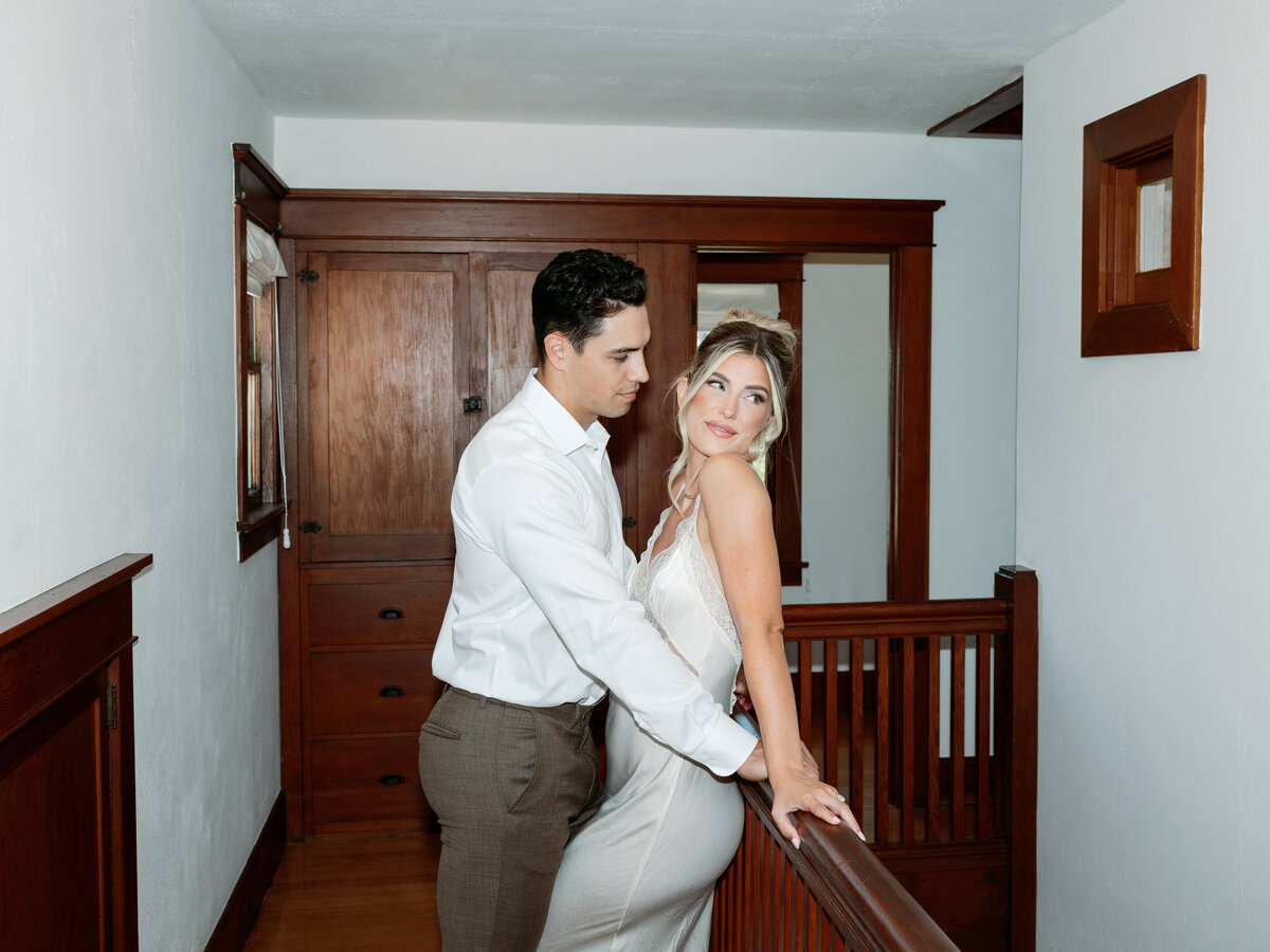 Bride and groom getting ready together, capturing a candid moment of love and anticipation before their La Jolla California wedding.