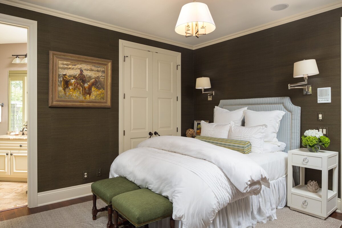 the keeping room interiors grandview bedroom with white bedding and wallpaper with frame of a indian and horses on wall