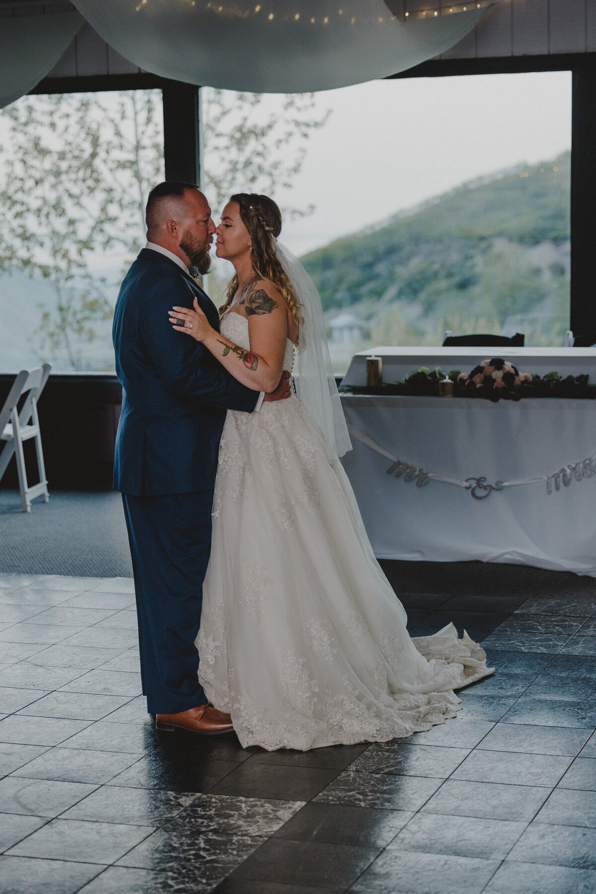 A bride and groom share a private last dance at their wedding venue before exiting