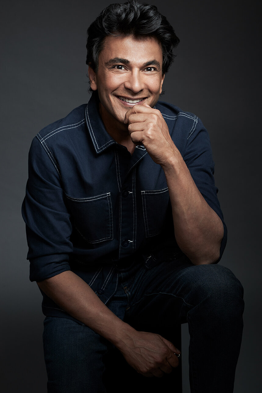 Vikas in a professional studio portrait, exuding confidence and approachability, shot by Ylva Erevall.