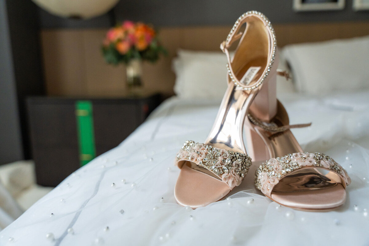 high heels sitting on bed