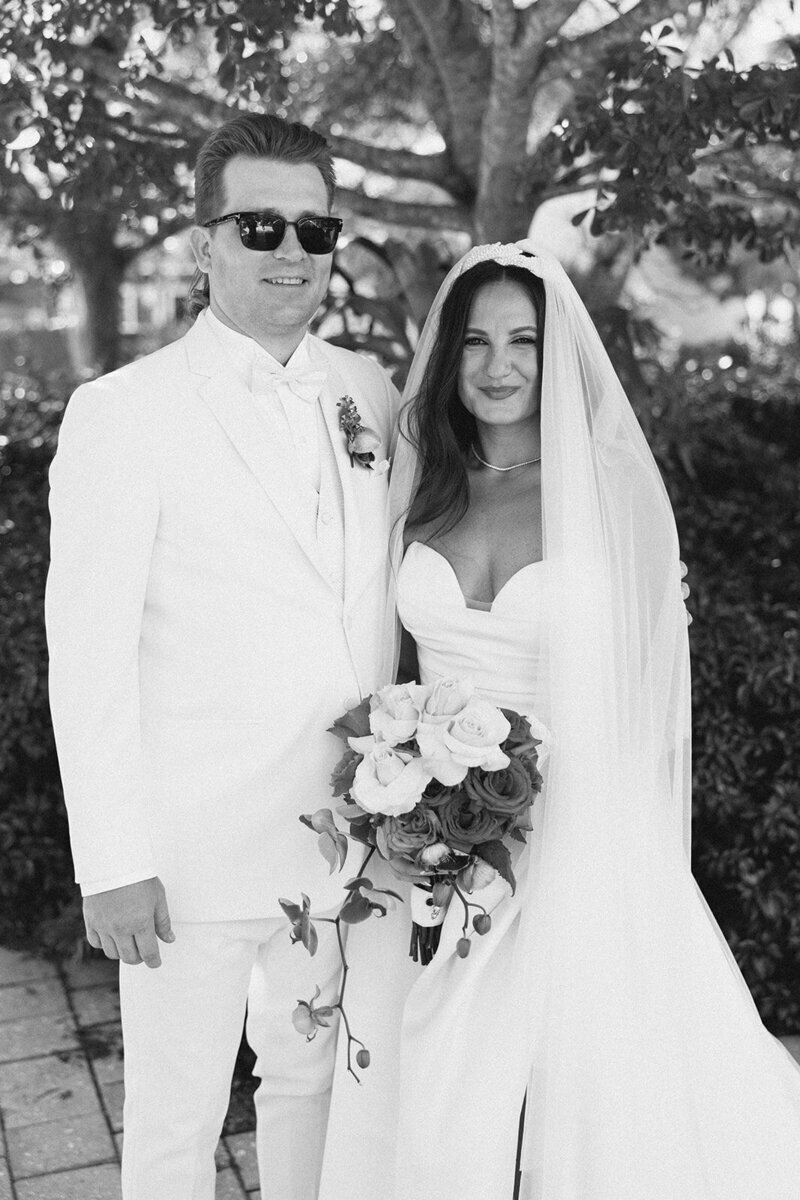 bride and groom smiling at penthouse at riverside wharf wedding