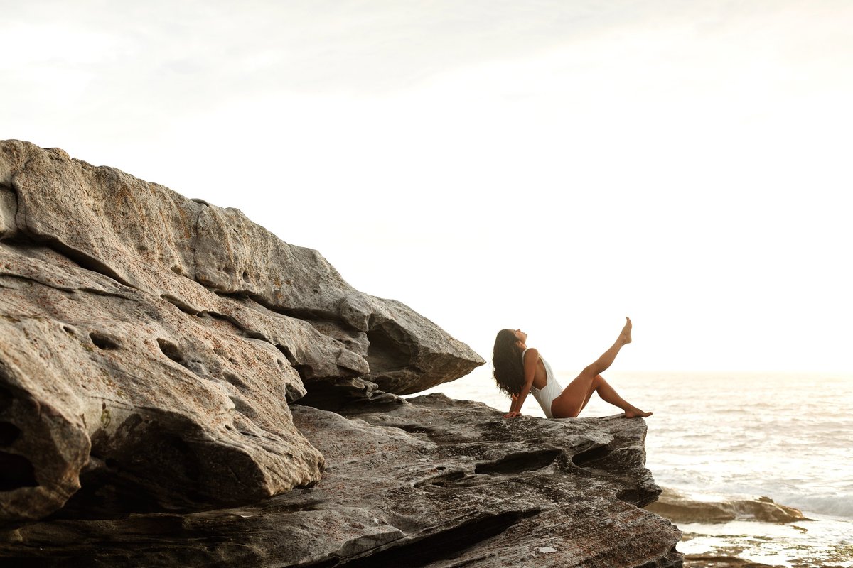 photo-of-woman-sitting-on-rock-3326363