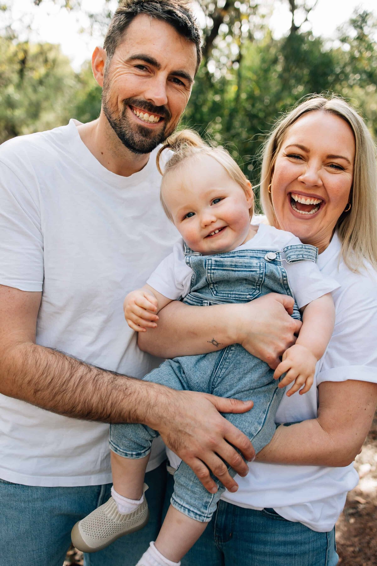Toddler with Mum and Dad, during redemption of Family Photography Gift Vouchers Melbourne
