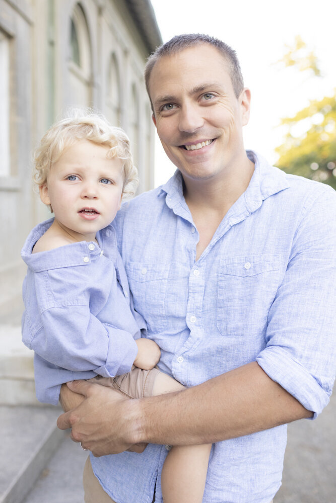 portrait of dad and son wearing blue shirts