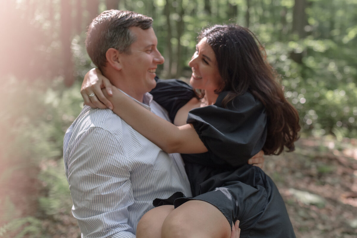 couple embracing in the forest