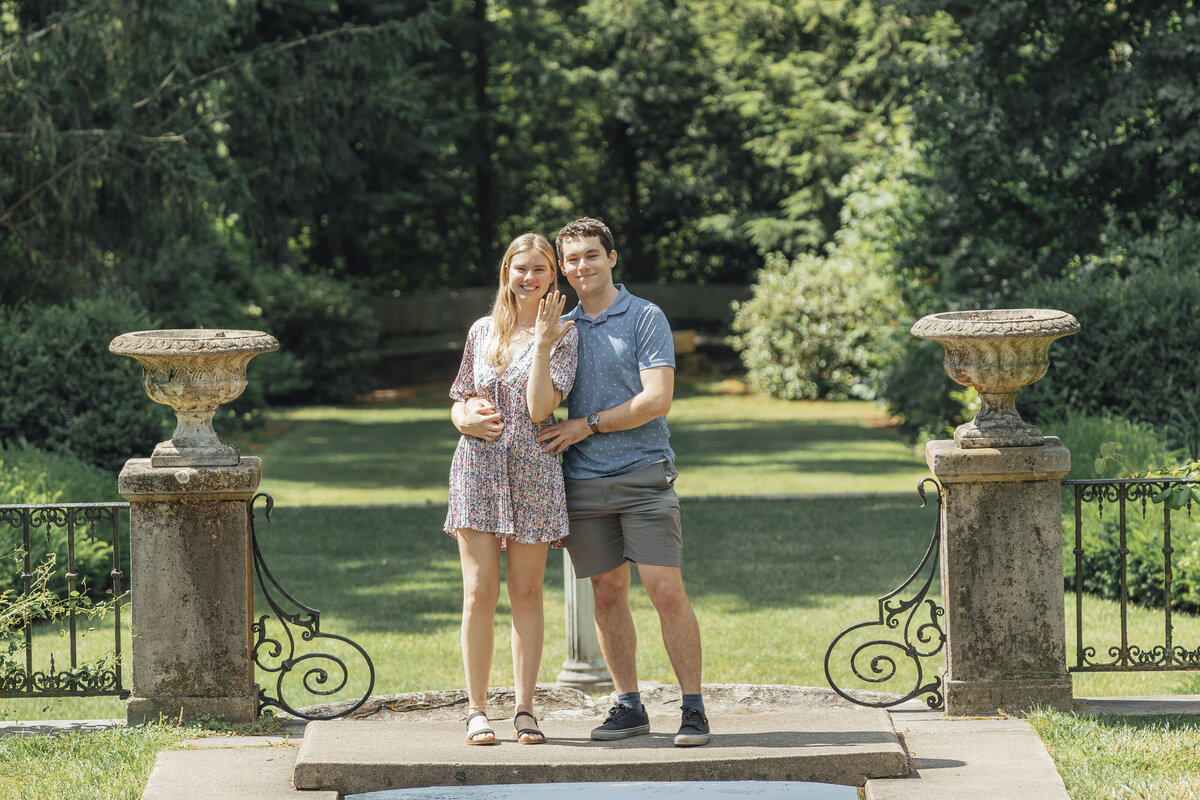Proposal Photographer | Groom-to-be proposing in the gardens surrounded by lush greenery and flowers | Ringwood, New Jersey