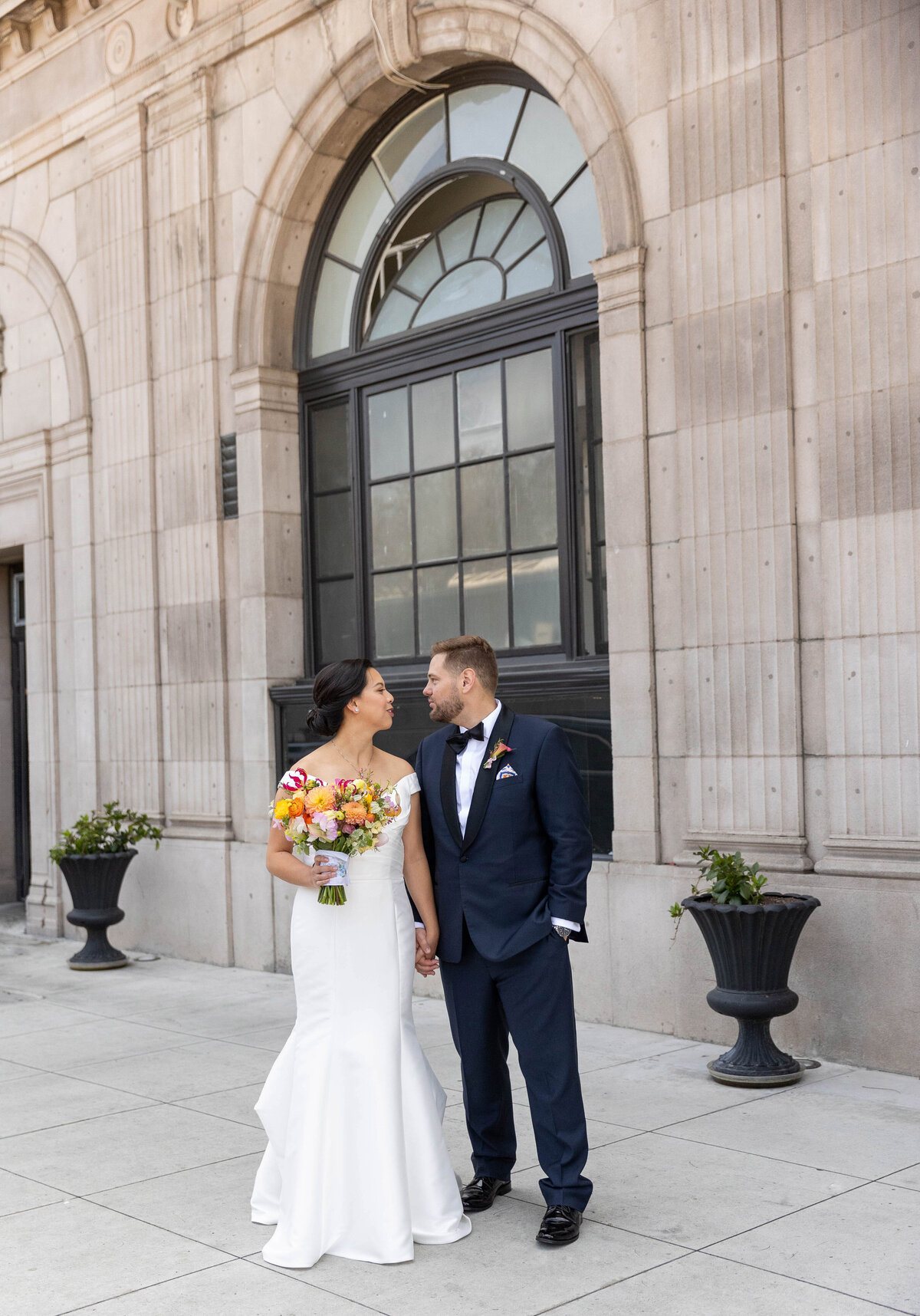 Bride and groom looking at each other at Culver Hotel