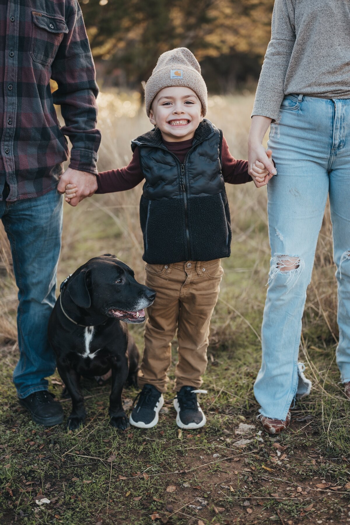 boy-holding-parents-hands