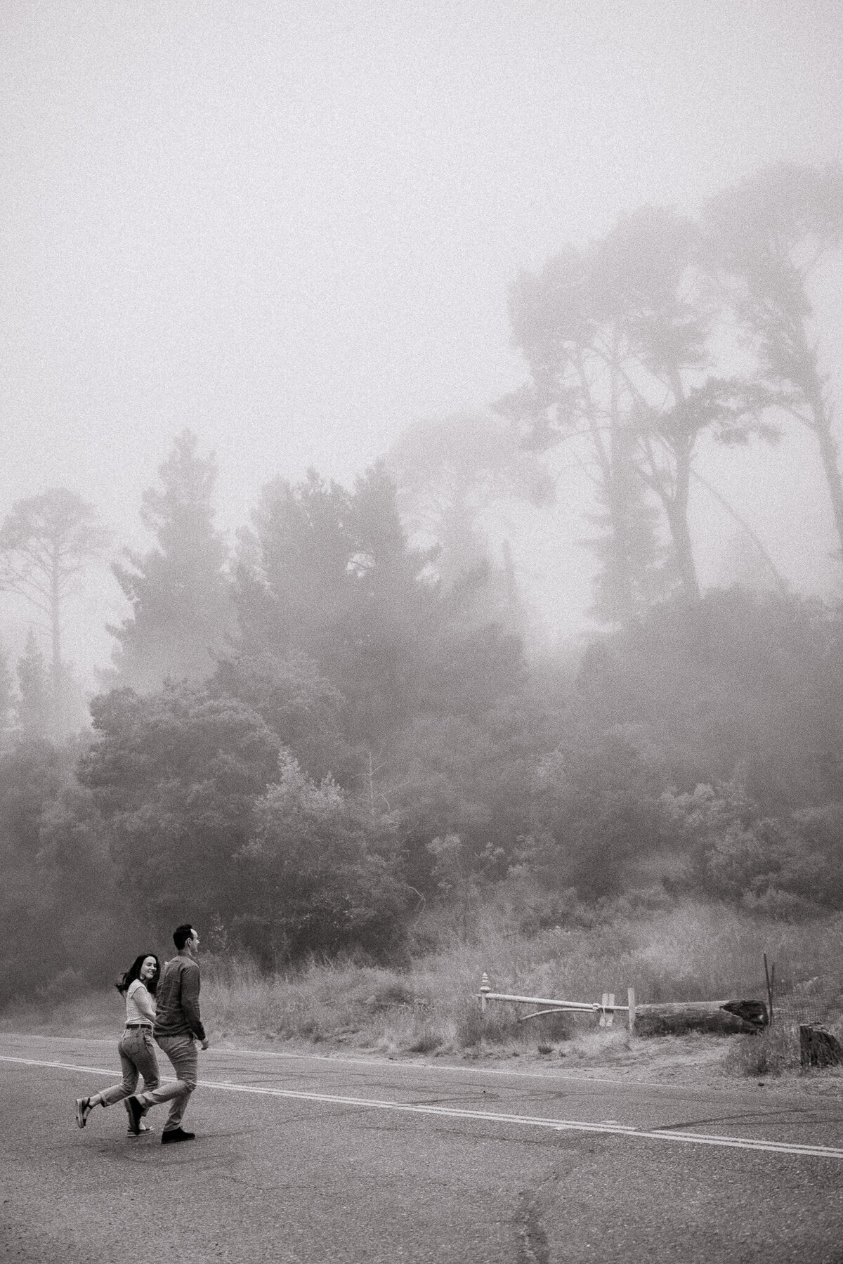 Bay Area adventure elopement session in the Oakland Redwoods. Couple runs across the street in Karl the Fog.