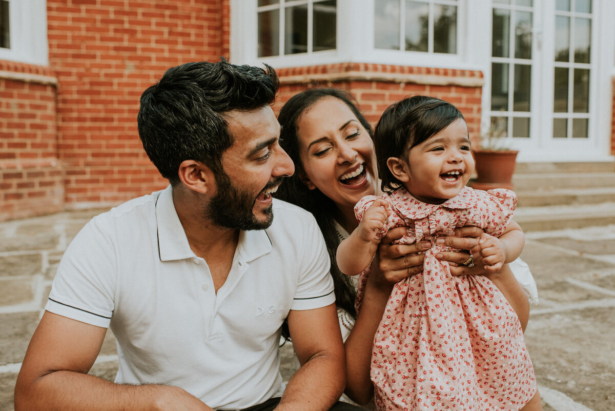 Family smiling with toddler