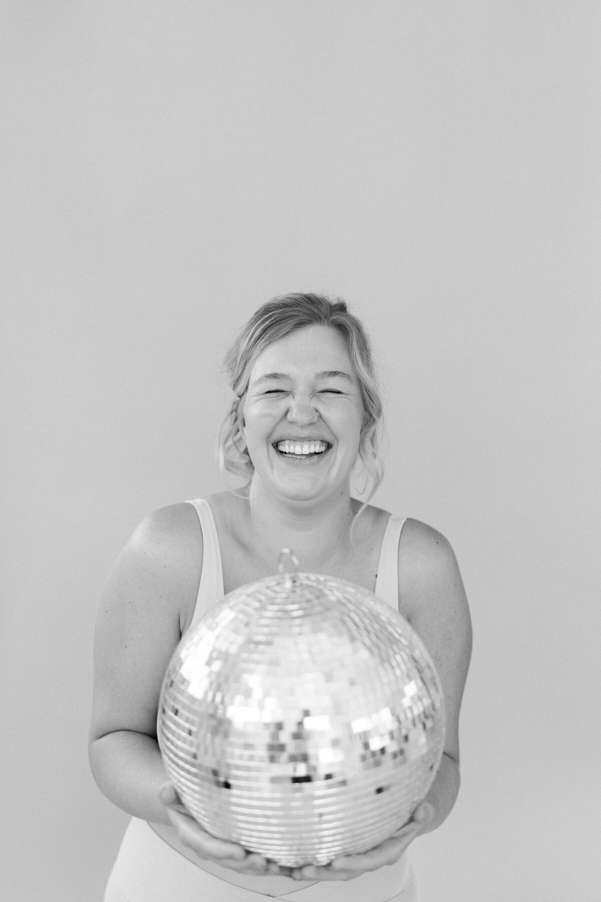 Girl holding a disco ball 