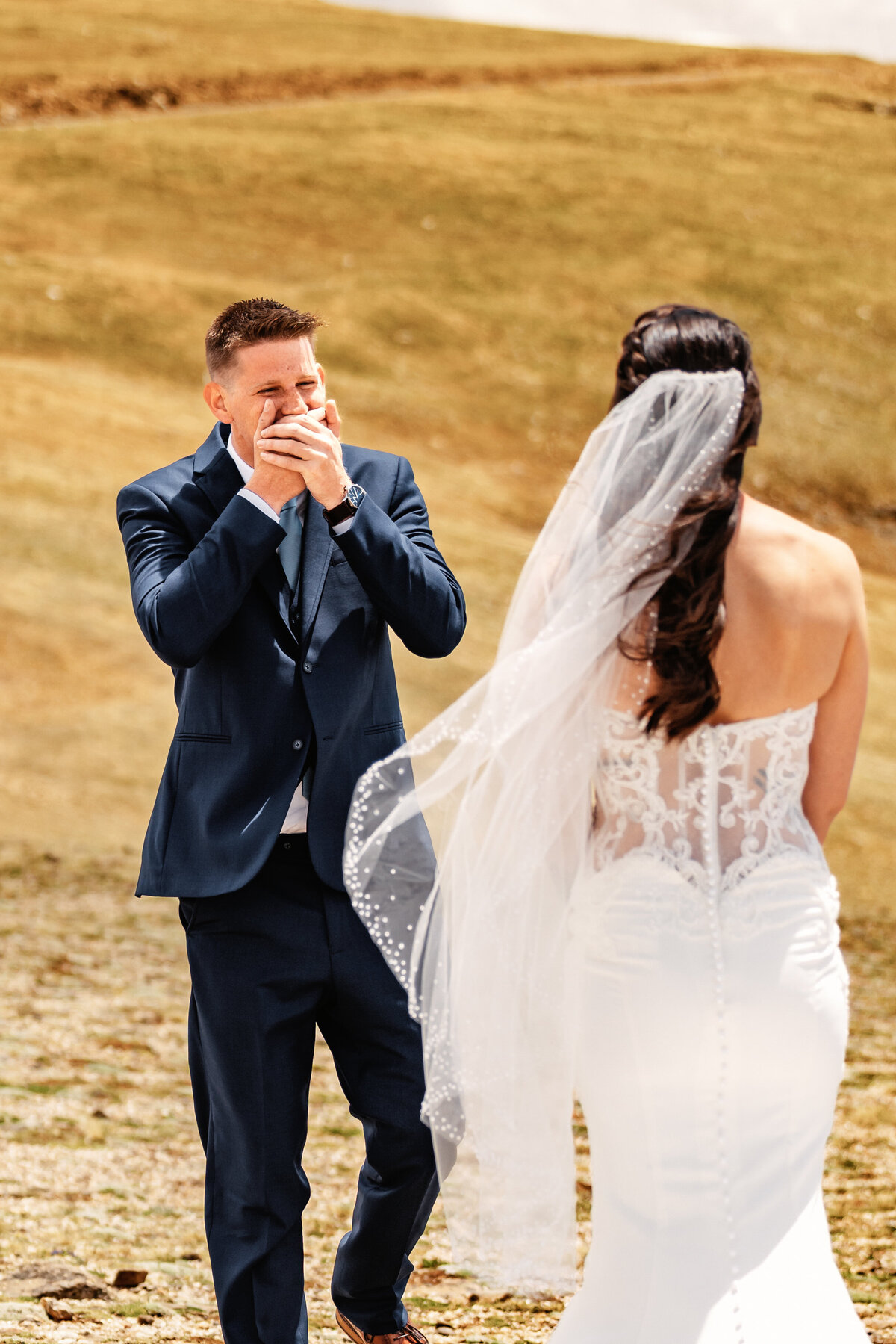 Shannon Lee, from Love Like Wild Photography, captures a groom's emotional reaction as he sees his bride for the first time.
