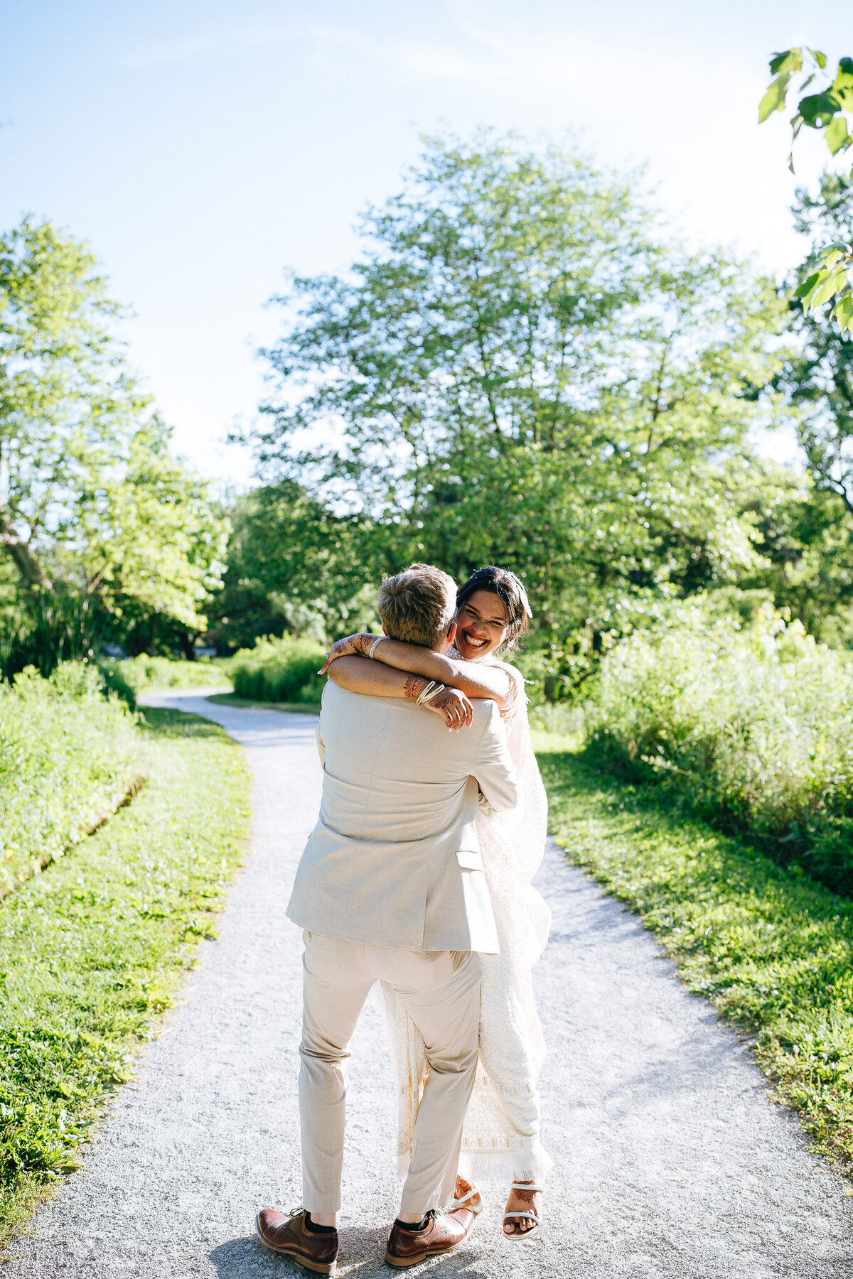 newlyweds laughing and hugging