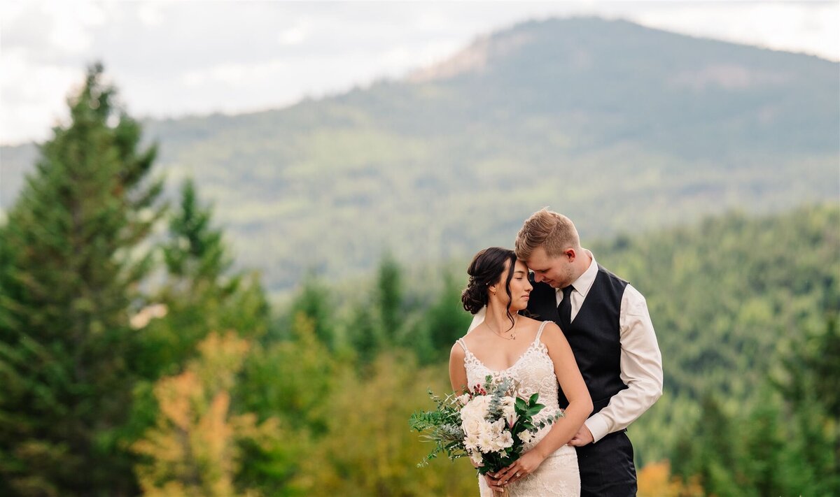 a wedding couple portrait in a forest