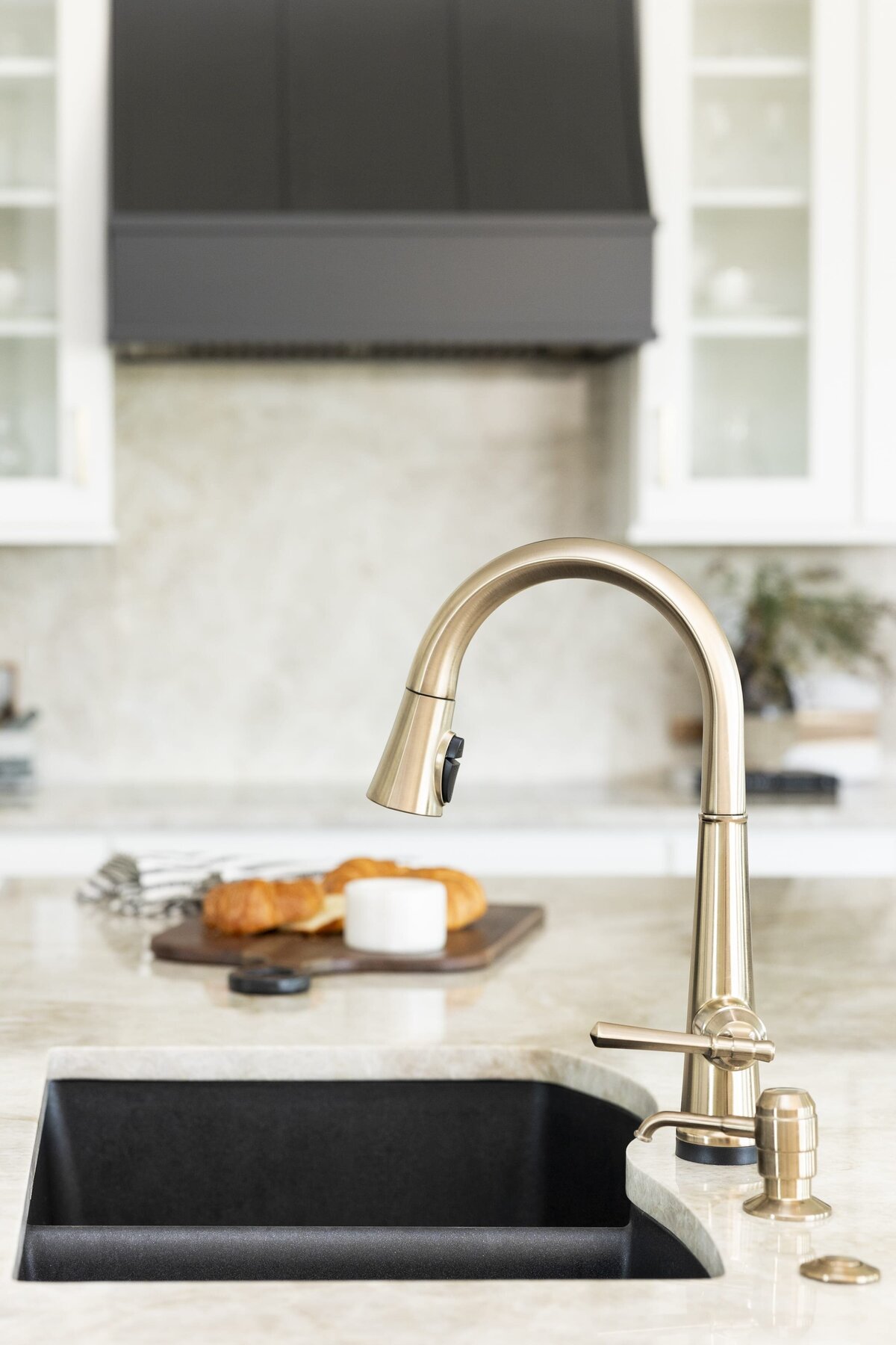 dewine design orlando interior designer windermere full home renovation kitchen gold faucet and black sink