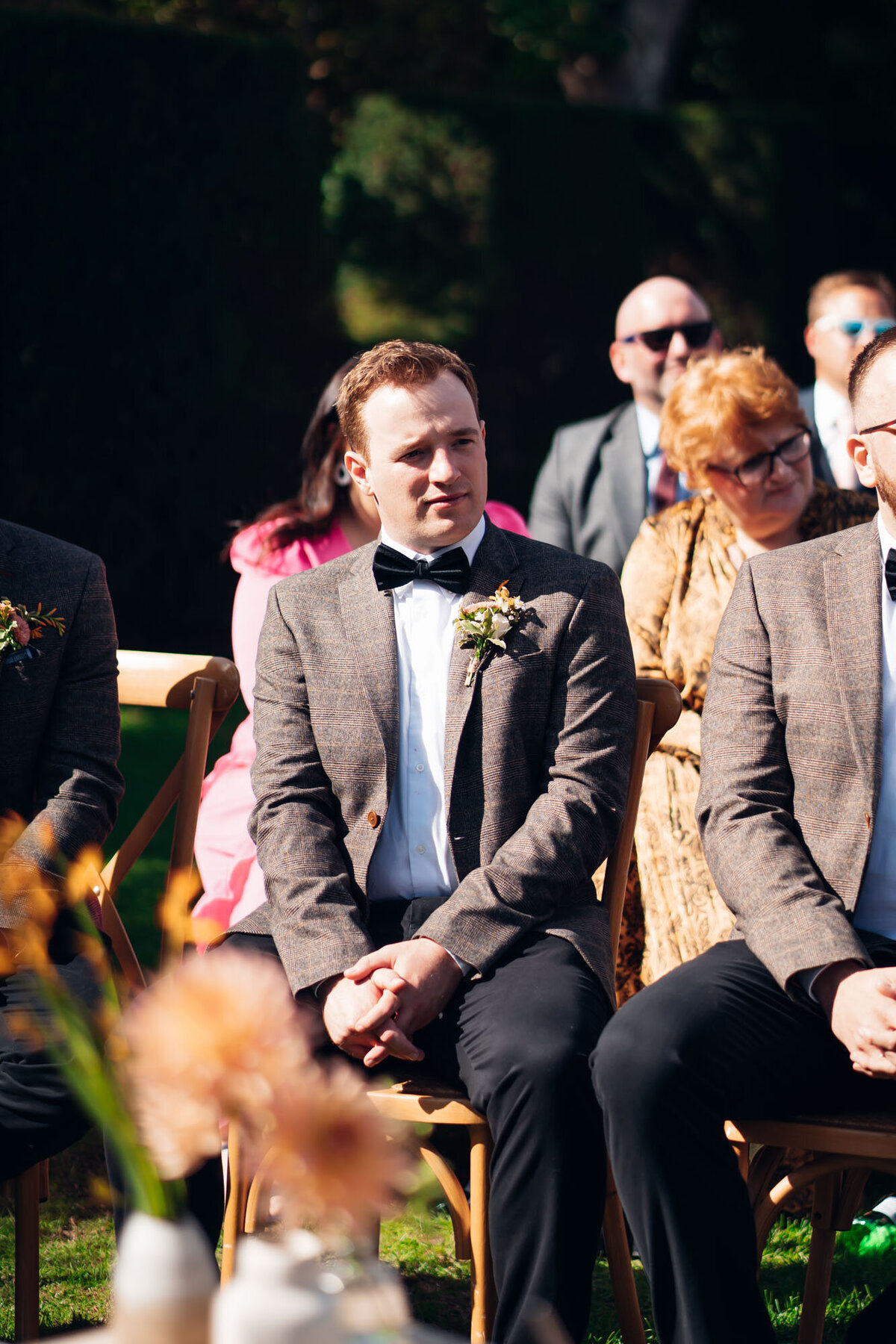 Pauntley-court-wedding-photographer-groomsmen-during-outdoor-ceremony