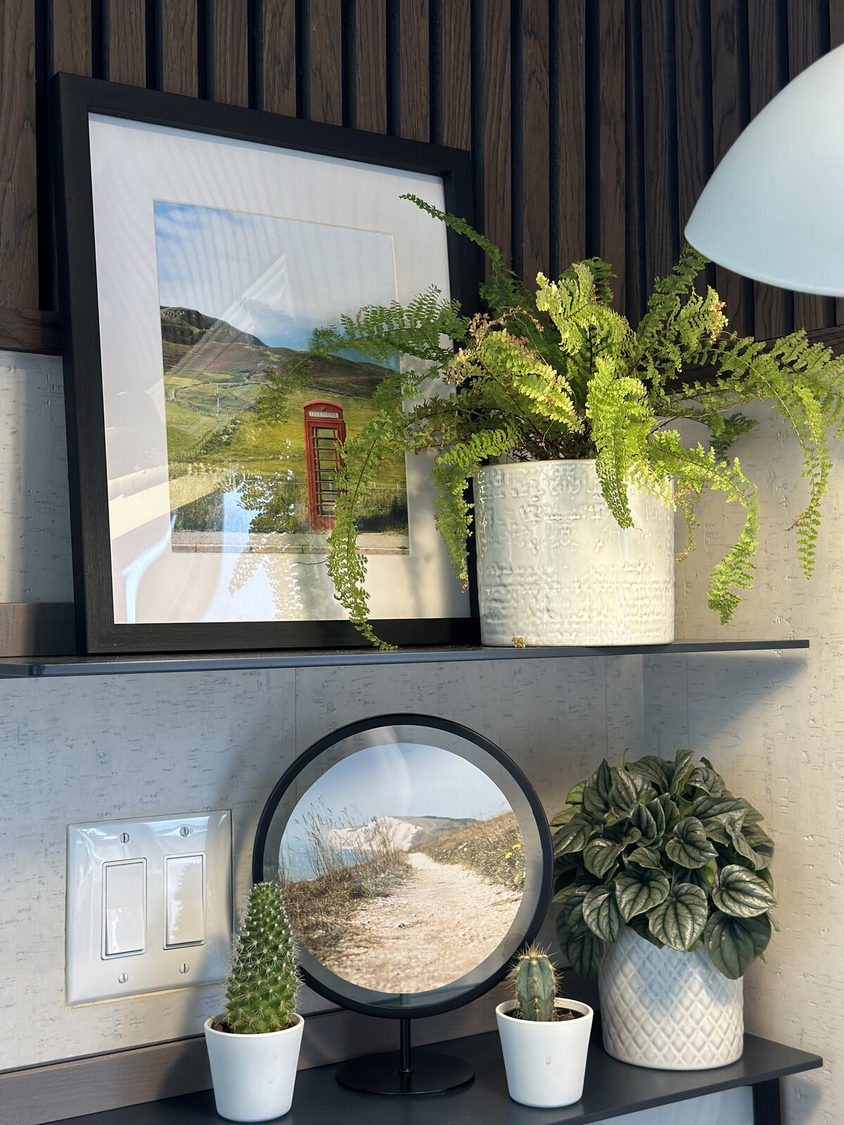 Shelf styling in modern home office nook with greenery and framed art, by Urbanomic Interiors in Barrhaven (Ottawa).